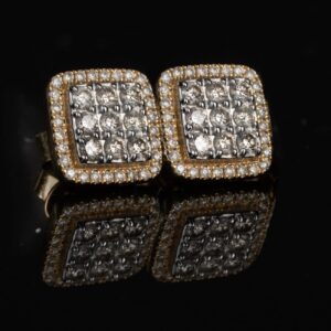 Aretes con diamantes con corte redondo.